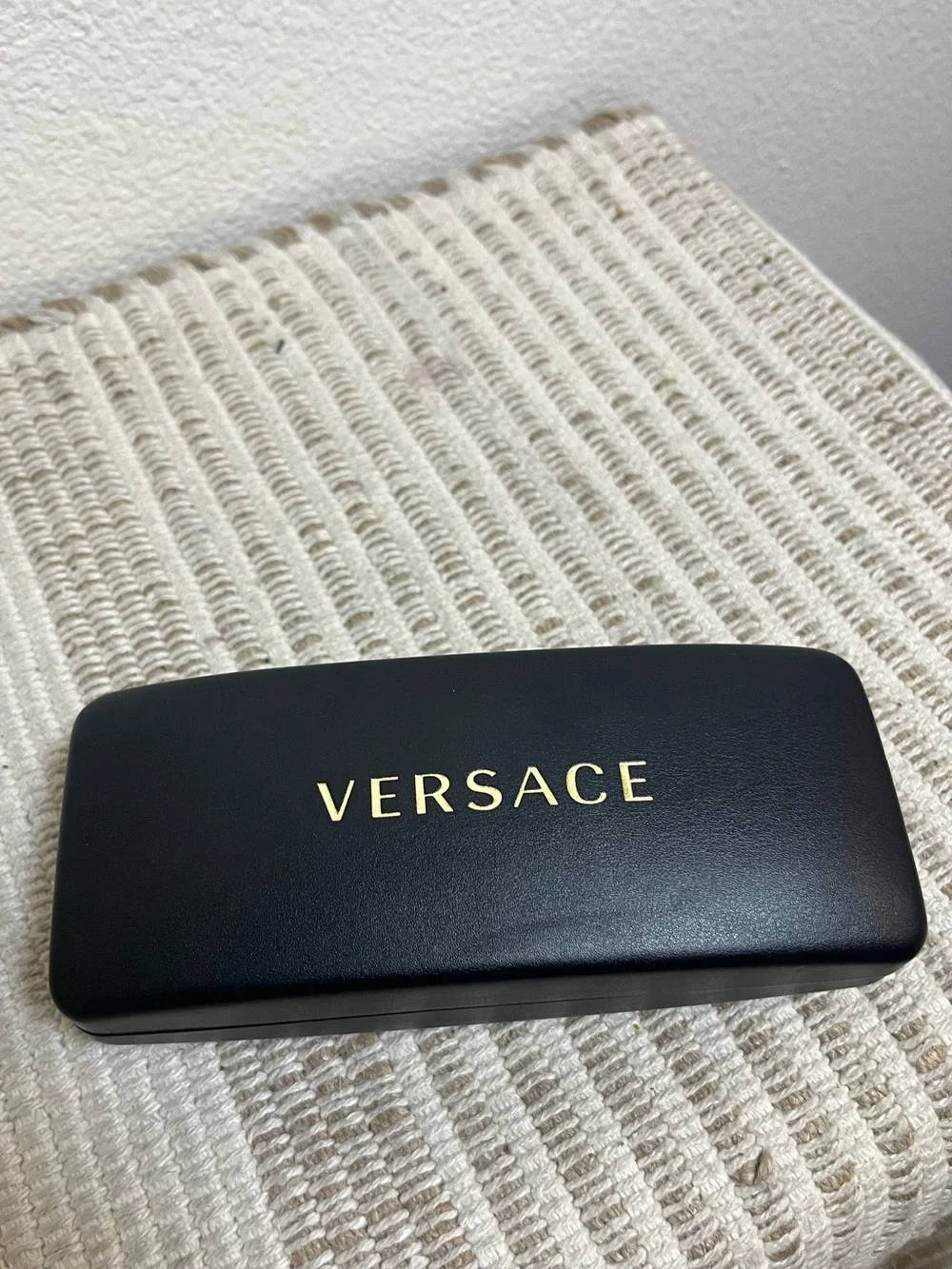 Versace Black Case with Gold Lettering
